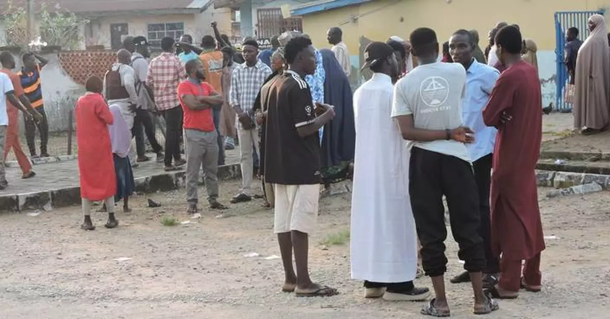 Nigerian police use tear gas during protests over the deaths in custody of 37 miners
