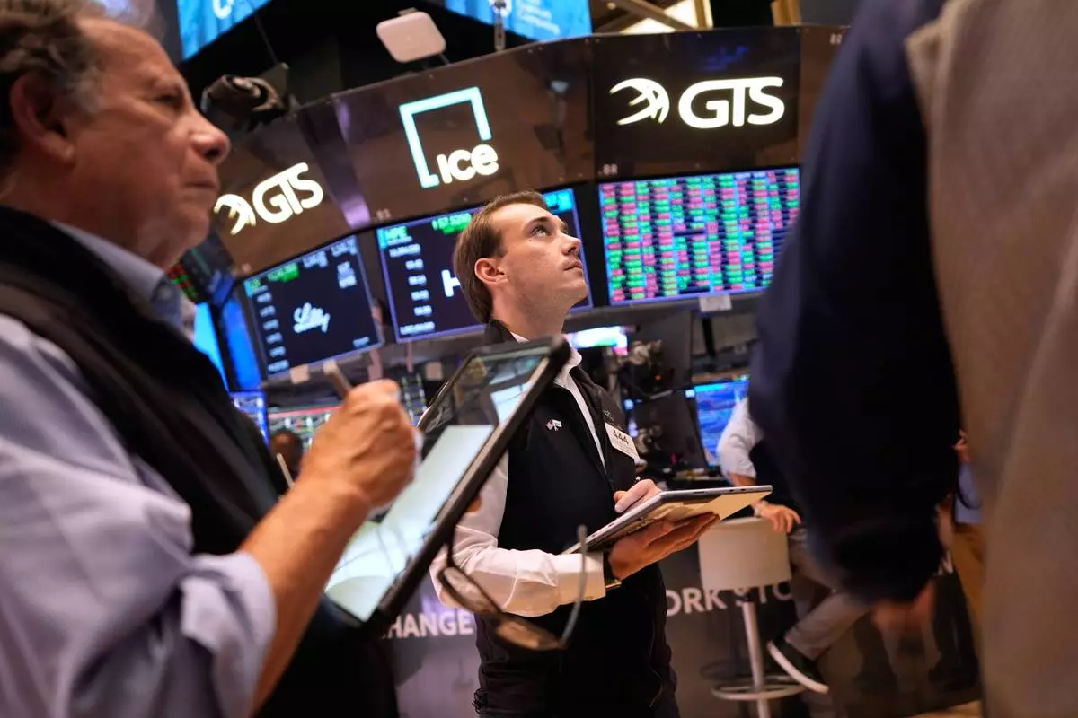 Traders work on the floor at the New York Stock Exchange in New York, Wednesday, Sept. 16, 2026. (AP Photo/Seth Wenig)