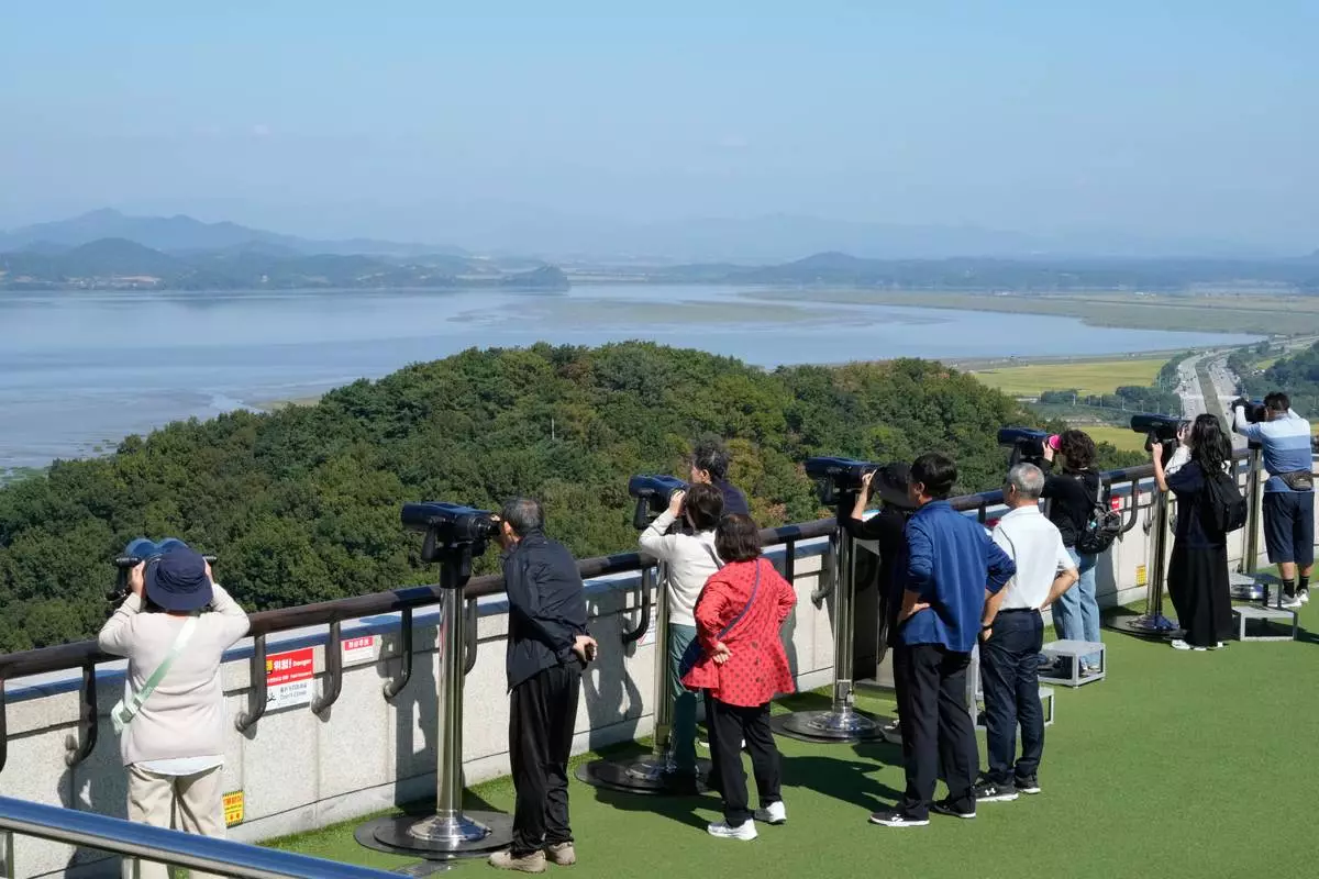 Visitors watch the North Korea side from the Unification Observation Post near the border with North Korea, in Paju, South Korea, Tuesday, Sept. 29, 2026. (AP Photo/Ahn Young-joon)