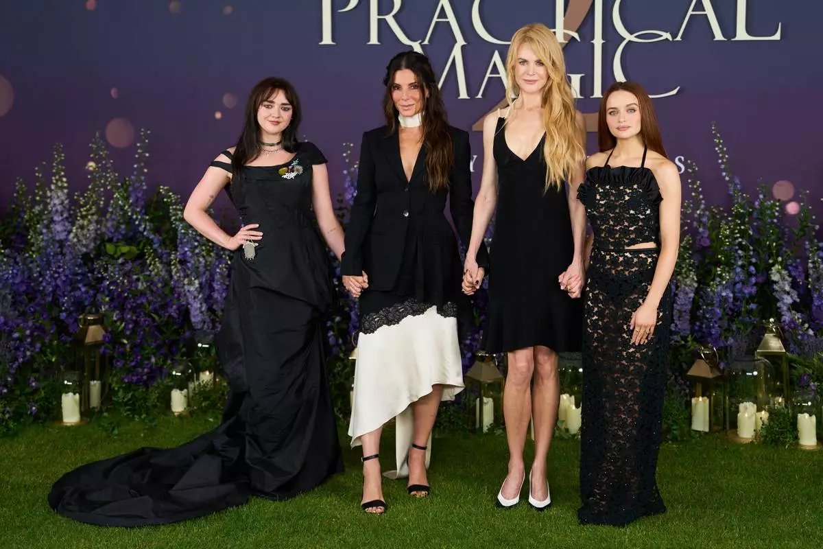 From left, Maisie Williams, Sandra Bullock, Nicole Kidman and Joey King pose for photographers upon arrival at the photo call for the film 'Practical Magic 2' on Thursday, Aug. 27, 2026, in London. (Photo by Scott A Garfitt/Invision/AP)