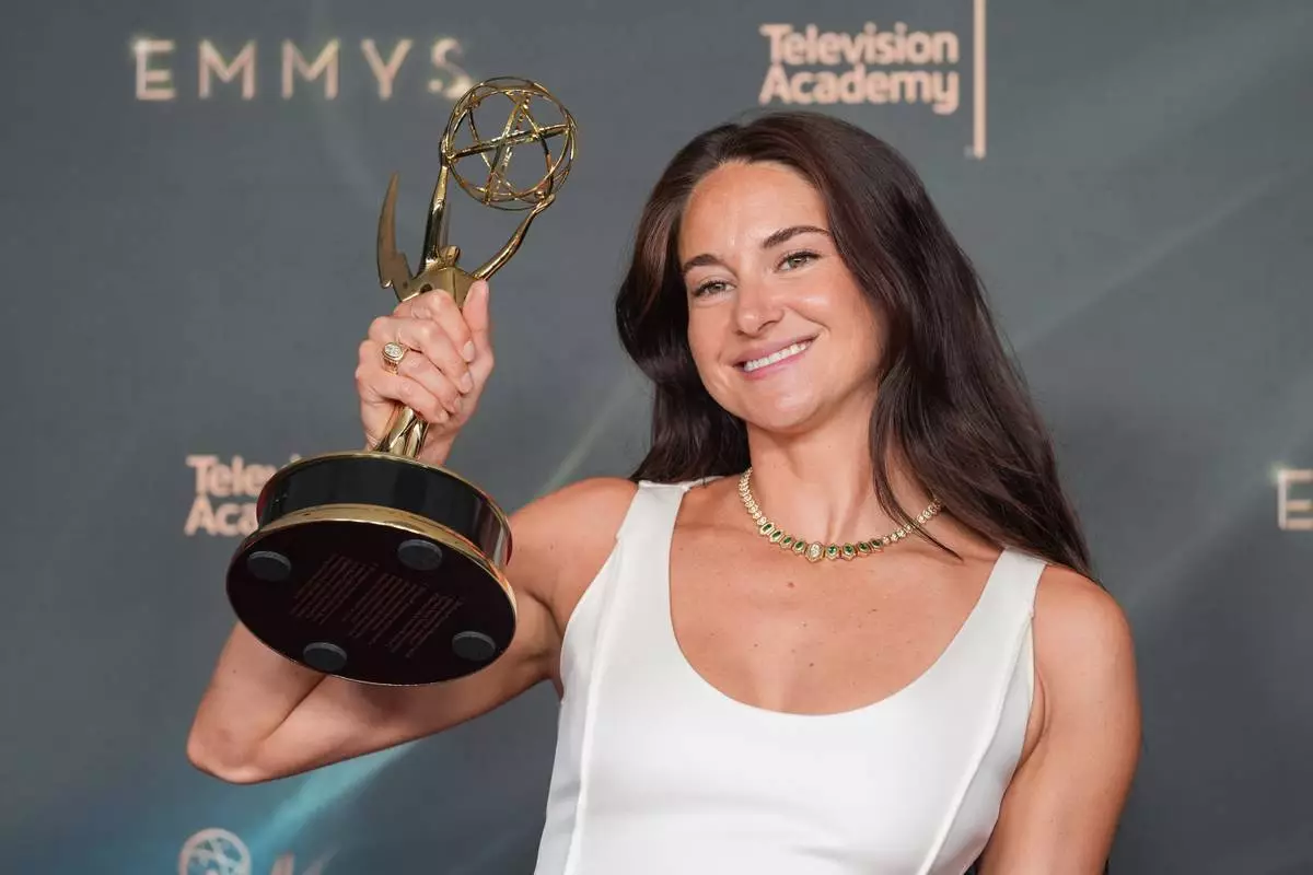 Shailene Woodley poses in the press room with the award for outstanding guest actress in a comedy series for "Paradise" during night two of the Creative Arts Emmy Awards on Sunday, Sept. 6, 2026, in Los Angeles. (AP Photo/Chris Pizzello)