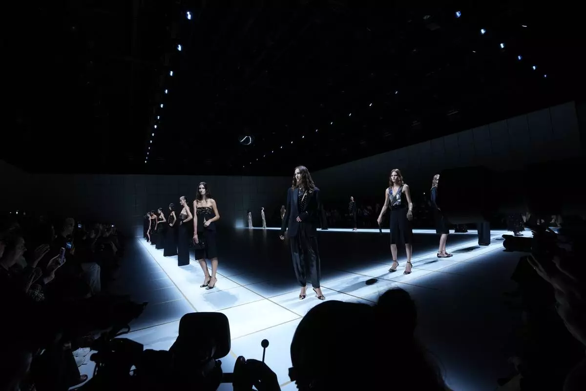 Models wear creations part of the Giorgio Armani women's Spring-Summer 2027 collection, presented in Milan, Italy, Sunday, Sept. 27, 2026. (AP Photo/Luca Bruno)