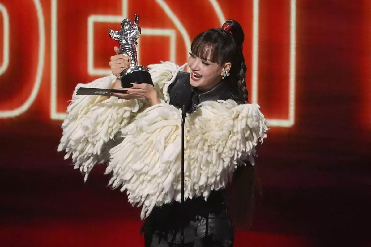 Lisa accepts the award for best pop for "Dream feat. Kentaro Sakaguchi" during the MTV Video Music Awards on Sunday, Sept. 27, 2026, at the Peacock Theater in Los Angeles. (AP Photo/Chris Pizzello) CORRECTION: Corrects name to Kentaro, instead of Kentara