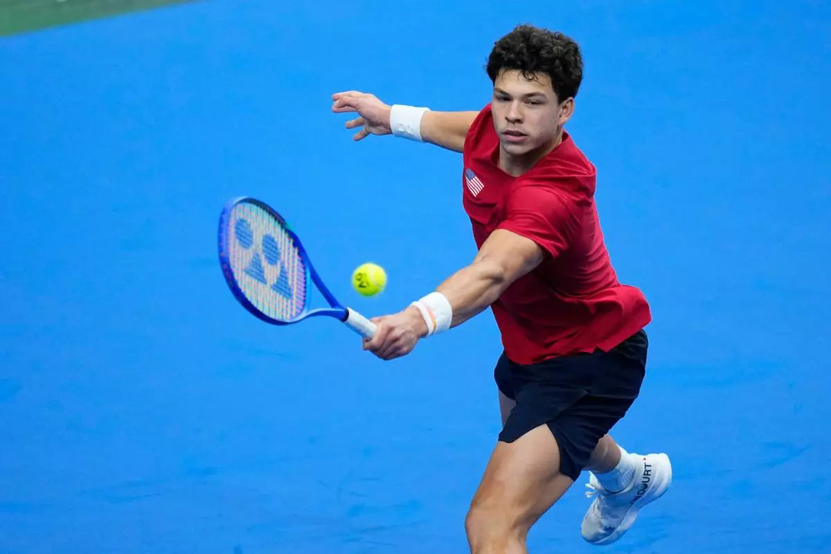 United States' Ben Shelton returns the ball to Czechia's Jakub Mensik during the Davis Cup second round qualifier match between the Czech Republic and the United States, in Prague, Saturday, Sept. 19, 2026. (AP Photo/Petr David Josek)
