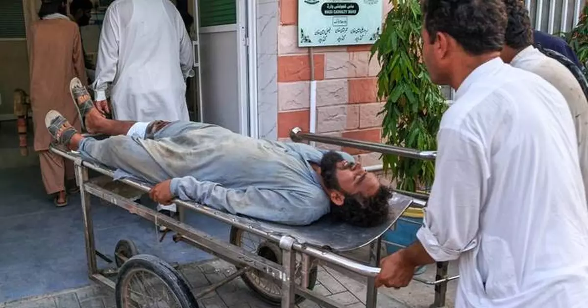 Gunmen target ambulance in Pakistan after suicide bombing at checkpoint killed 12