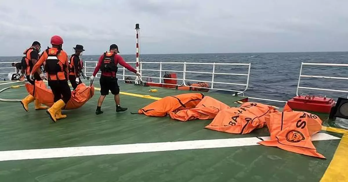 Divers recover a total of 52 bodies from capsized ferry in Indonesia after a dayslong search