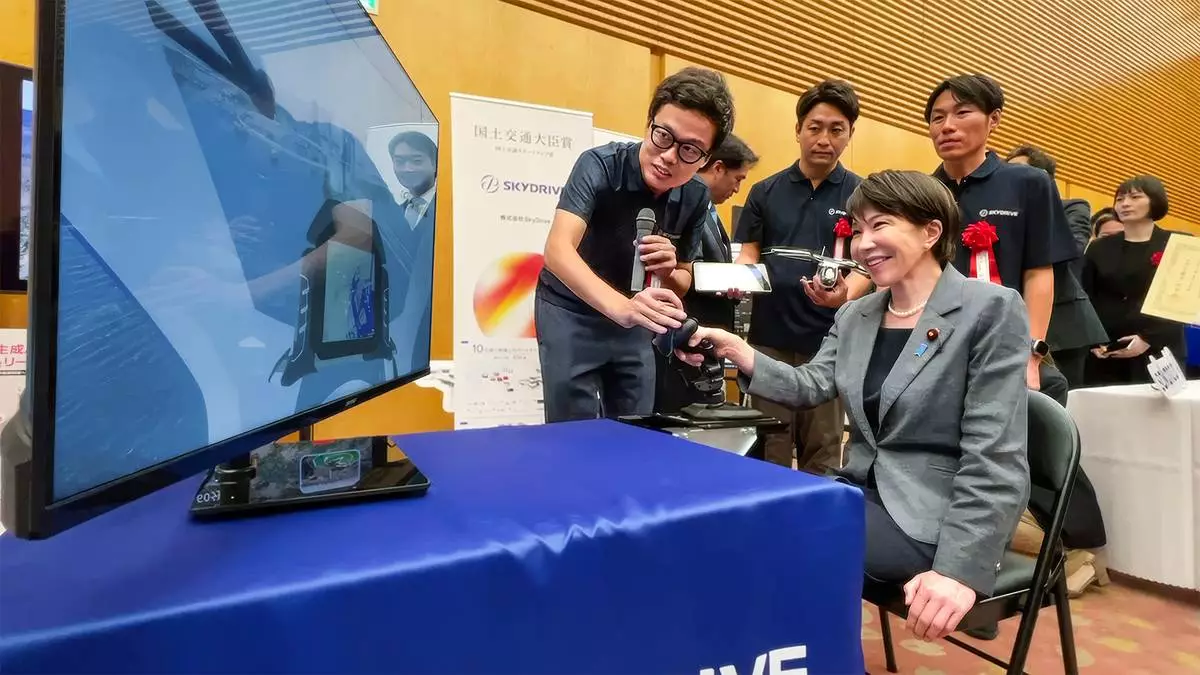 Japanese Prime Minister Sanae Takaichi visiting the SkyDrive booth