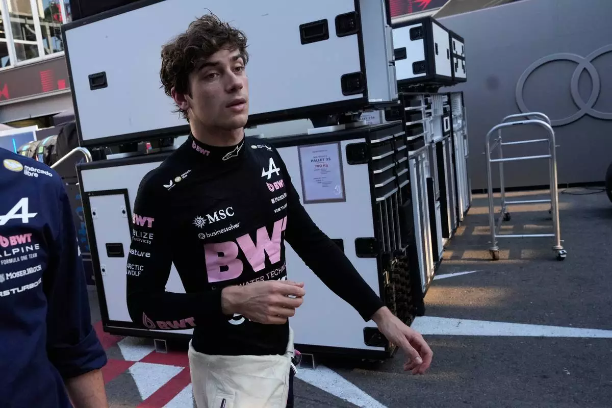 Alpine driver Franco Colapinto of Argentina walks down pit lane following his crash during the Azerbaijan F1 Grand Prix auto race, in Baku, Azerbaijan, Saturday, Sept. 26, 2026. (AP Photo/Darko Bandic) CORRECTION: Photographer Darko Bandic instead of Pavel Bednyakov