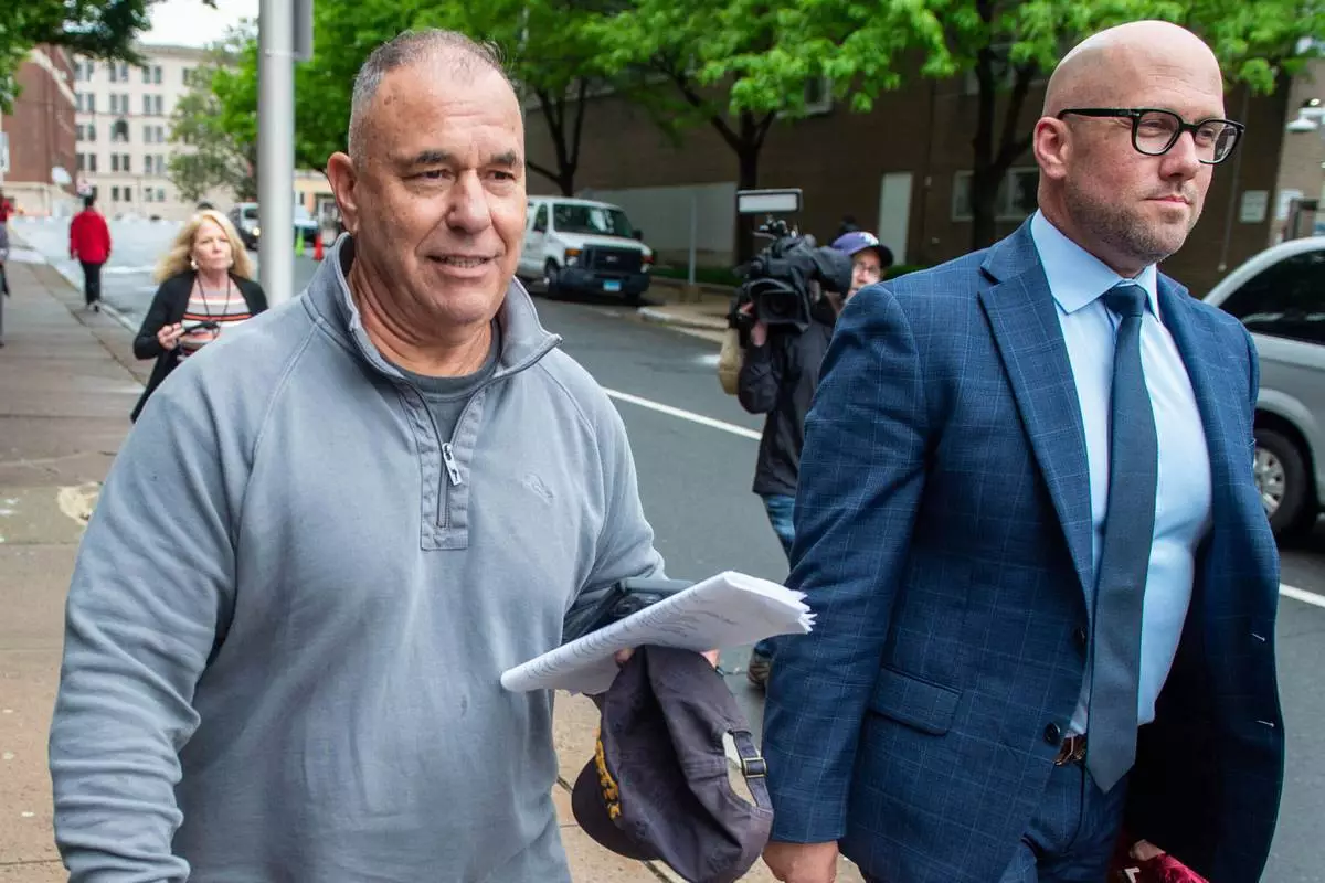 FILE - Former Connecticut deputy budget director Konstantinos "Kosta" Diamantis, left, accompanied by his lawyer Vincent Provenzano, right, walks out of federal court on May 16, 2024, in Hartford, Conn. (Aaron Flaum/Hartford Courant via AP, File)