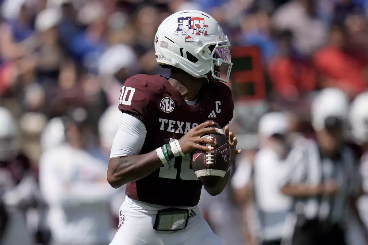 Texas A&M quarterback Marcel Reed (10) looks to pass downfield against Arizona State during the first quarter of an NCAA college football game Saturday, Sept. 12, 2026, in College Station, Texas. (AP Photo/Sam Craft)
