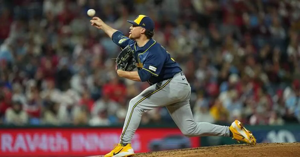 Brewers reach 100 wins for first time, slow Phillies' playoff push with 5-1 victory