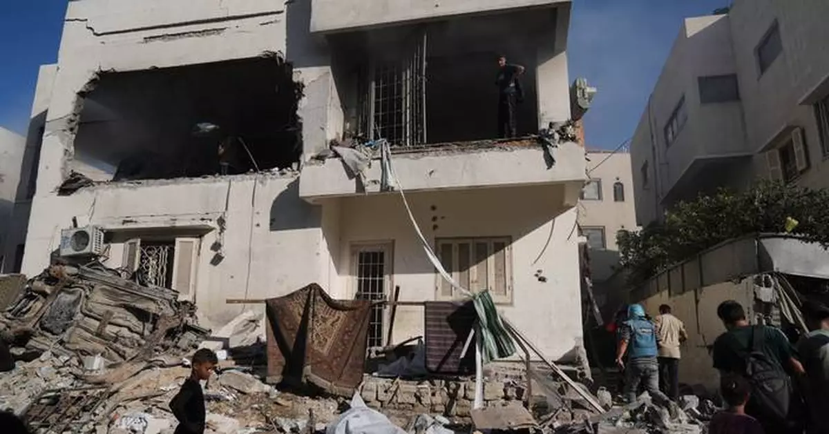 A damaged building collapses in Gaza, killing at least 12 people and other Mideast developments