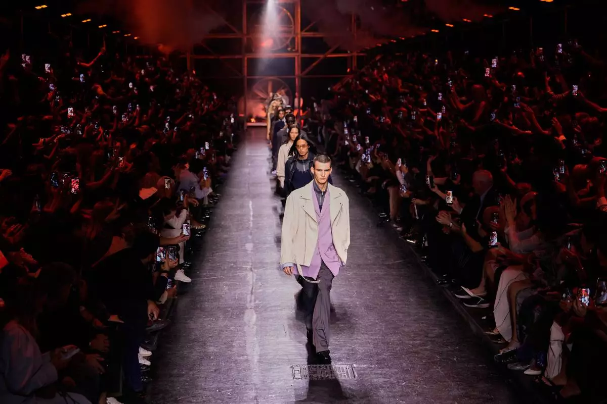 Models wear creations from Diesel's Spring-Summer 2027 collection presented in Milan, Italy, Tuesday, Sept. 22, 2026. (AP Photo/Luca Bruno)