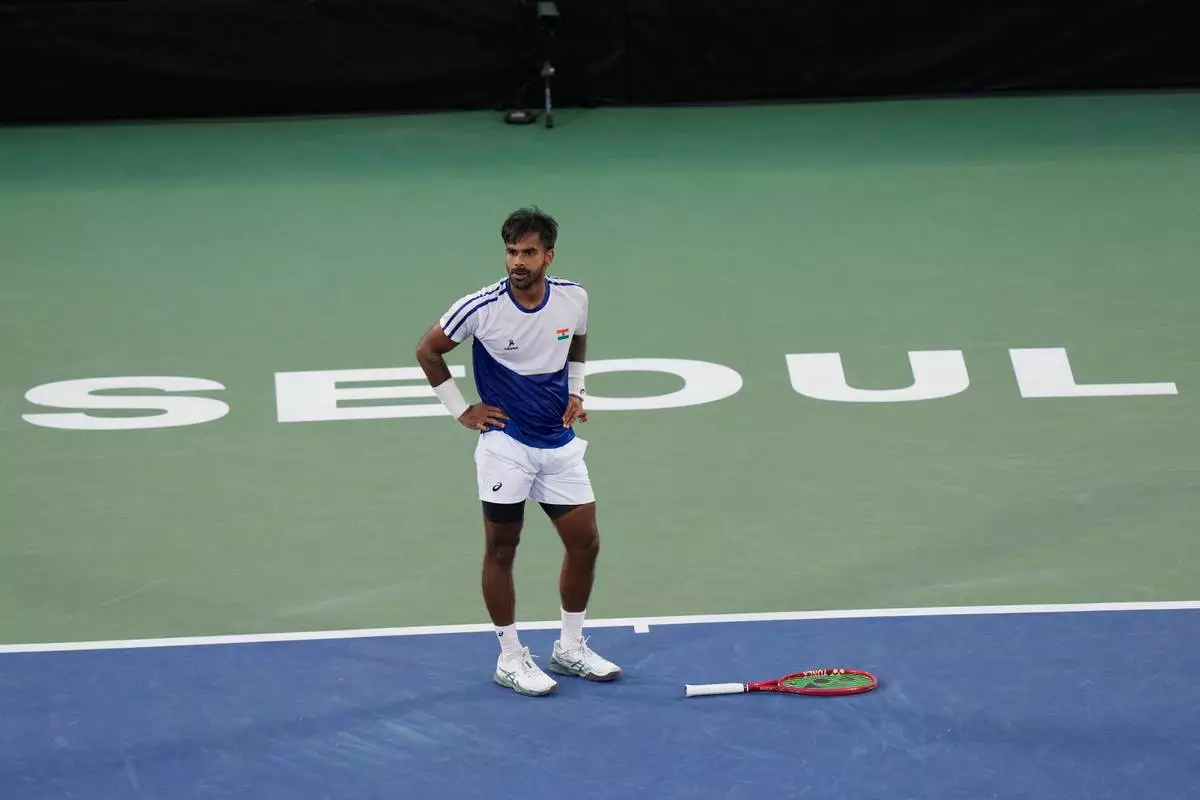 India's Sumit Nagal stands after missing a point against South Korea's Hyeon Chung during a Davis Cup second round qualifier tennis match between South Korea and India, in Seoul, South Korea, Friday, Sept. 18, 2026. (AP Photo/Ahn Young-joon)
