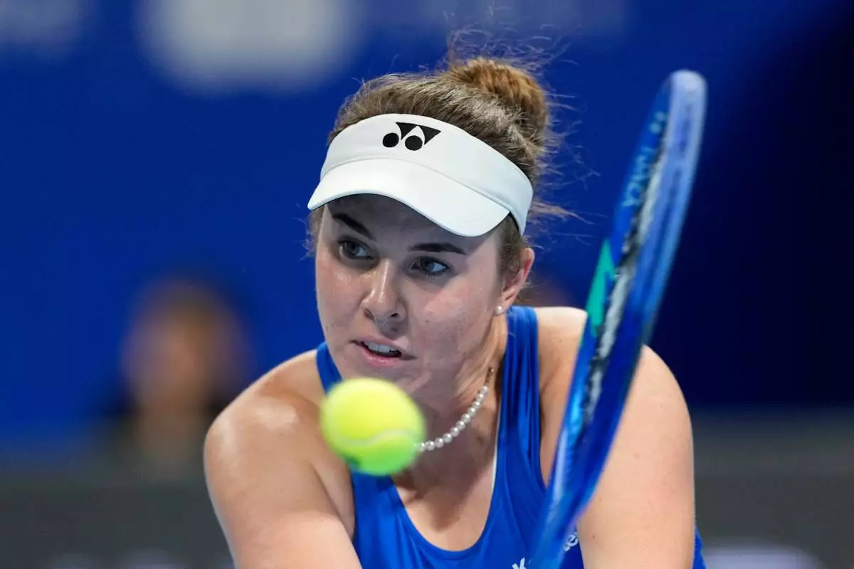 Linda Noskova of Czech Republic returns the ball to Katie Boulter of Britain in a quarterfinal match for the Billie Jean King Cup held in Shenzhen in southern China's Guangdong province, Tuesday, Sept. 22, 2026. (AP Photo/Andy Wong)