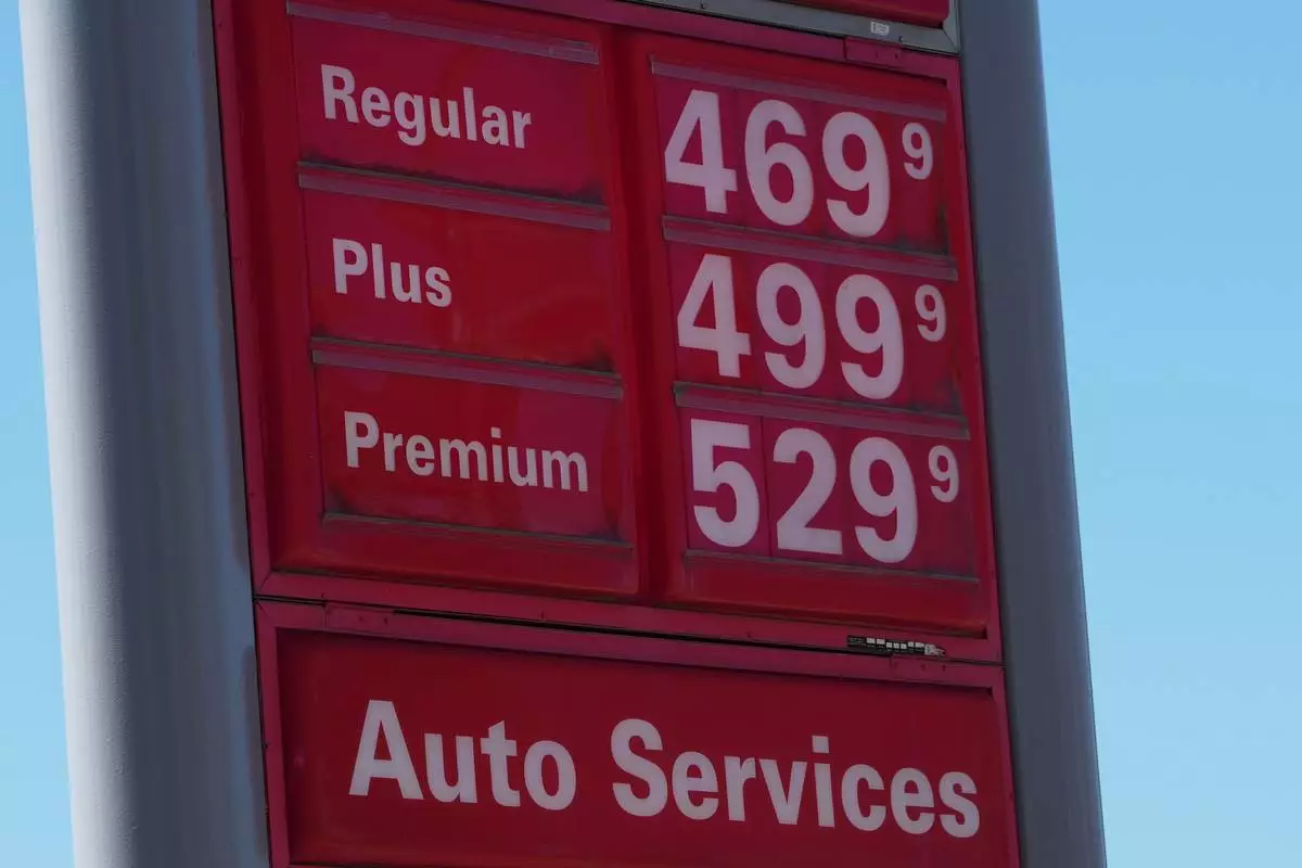 The per-gallon prices for the various grades of fuel available is displayed on a sign outside a Conoco gasoline station Wednesday, Sept. 9, 2026, in Denver. (AP Photo/David Zalubowski)