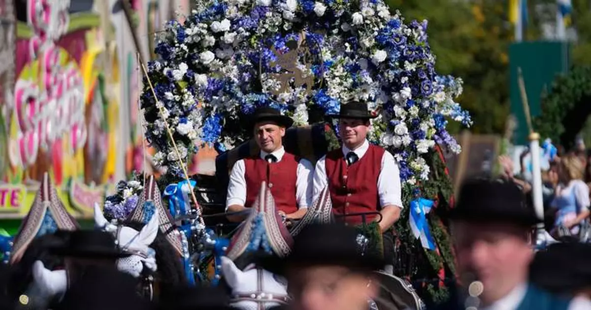 Munich’s Oktoberfest roars to life as the mayor taps the first keg