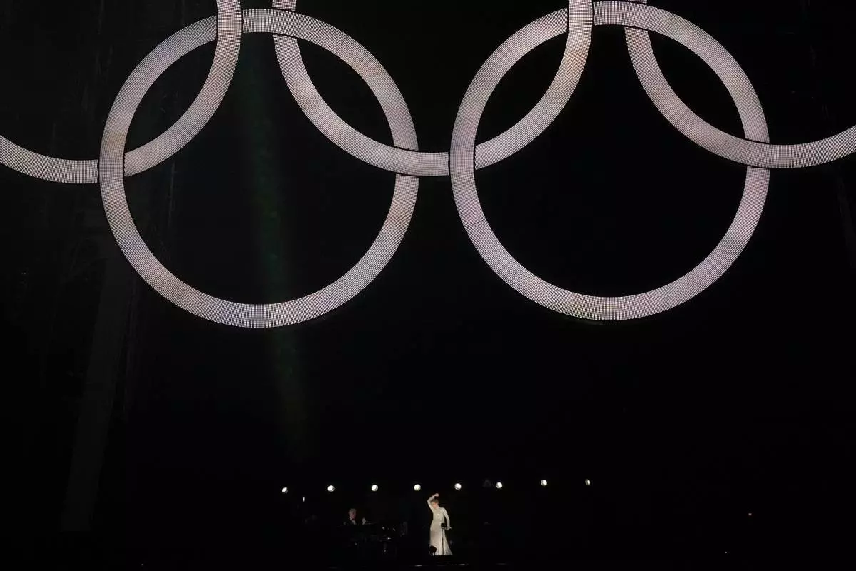 FILE - Celine Dion performs in Paris, France, during the opening ceremony of the 2024 Summer Olympics, July 26, 2024. (AP Photo/Thibault Camus, File)