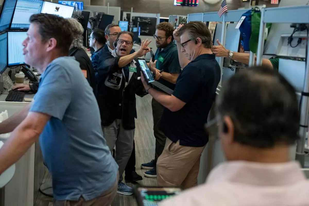 Options trader Anthony Spina works on the floor of the New York Stock Exchange, Thursday, Aug. 27, 2026, in New York. (AP Photo/Yuki Iwamura)
