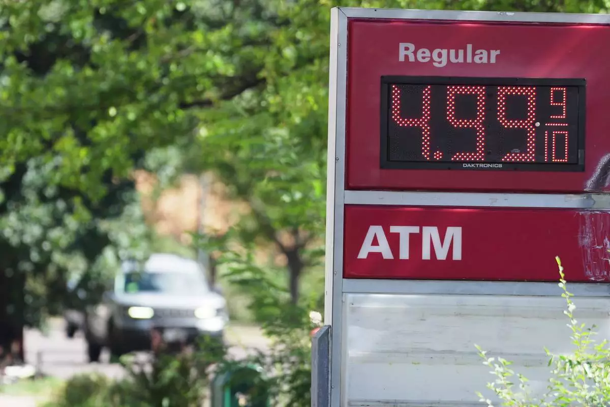 The per-gallon price for regular unleaded fuel is displayed electronically on a sign outside a Conoco gasoline station Wednesday, Sept. 9, 2026, in Denver. (AP Photo/David Zalubowski)