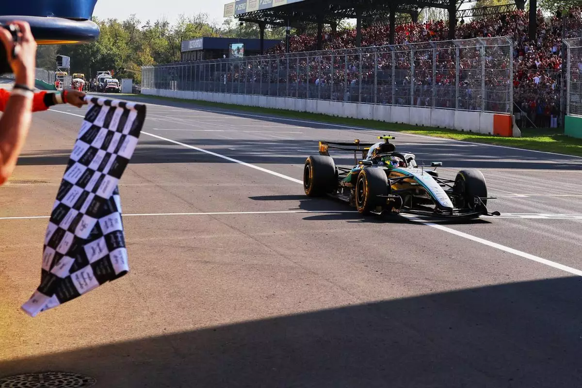 Mercedes driver Andrea Kimi Antonelli of Italy crosses the finish line to win the Italian Formula One Grand Prix race, in Monza, Italy, Sunday, Sept. 6, 2026. (Anna Szilagyi/Pool Photo via AP)