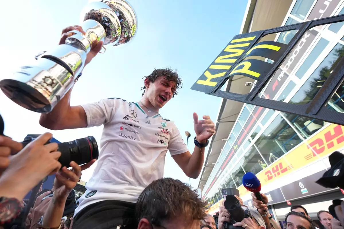 Mercedes driver Mercedes driver Andrea Kimi Antonelli of Italy celebrates after winning the Italian Formula One Grand Prix race, in Monza, Italy, Sunday, Sept. 6, 2026. (AP Photo/Antonio Calanni)