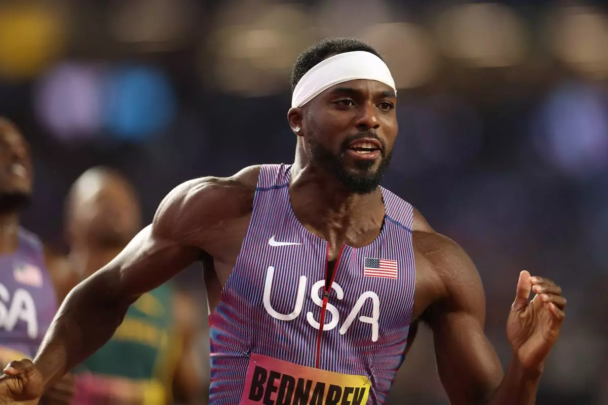 Kenneth Bednarek, of the United States, reacts after winning the men's 100 meters final during the World Athletics Ultimate Championship in Budapest, Hungary, Saturday, Sept. 12, 2026. (AP Photo/Armin Durgut) CORRECTION: Corrects ID to Kenneth Bednarek instead of Melissa Jefferson-Wooden and competition to Men's 100 meters instead of Women's 100 meters