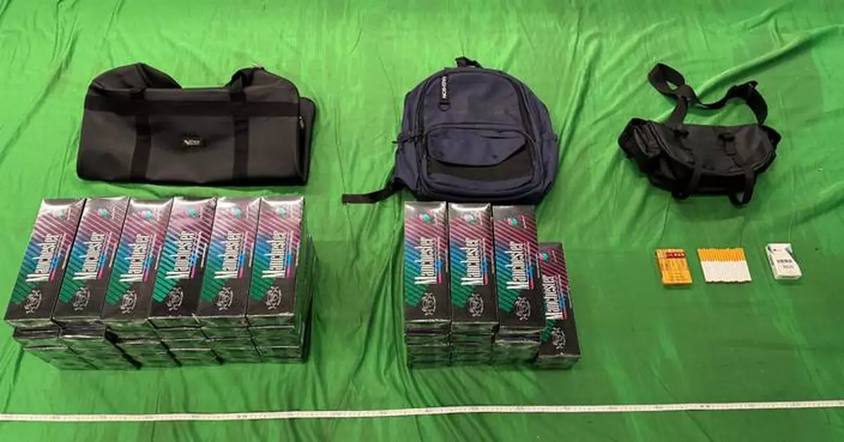 Woman jailed for two months, fined $2,000 for smuggling nearly 10,000 illicit cigarettes into Hong Kong.