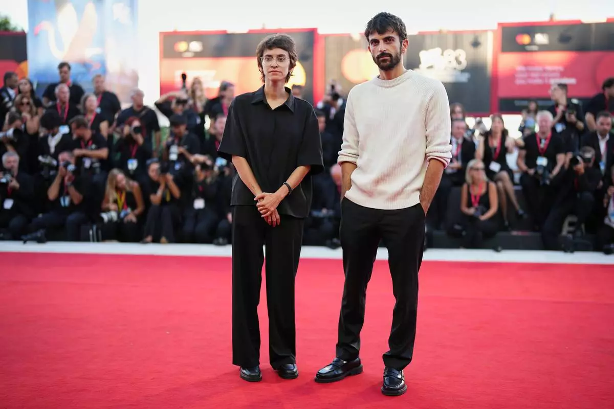 Rachel Szor, left, and Yuval Abraham pose for photographers at the closing ceremony red carpet during the 83rd edition of the Venice Film Festival in Venice, Italy, on Saturday, Sept. 12, 2026. (Photo by Scott A Garfitt/Invision/AP)