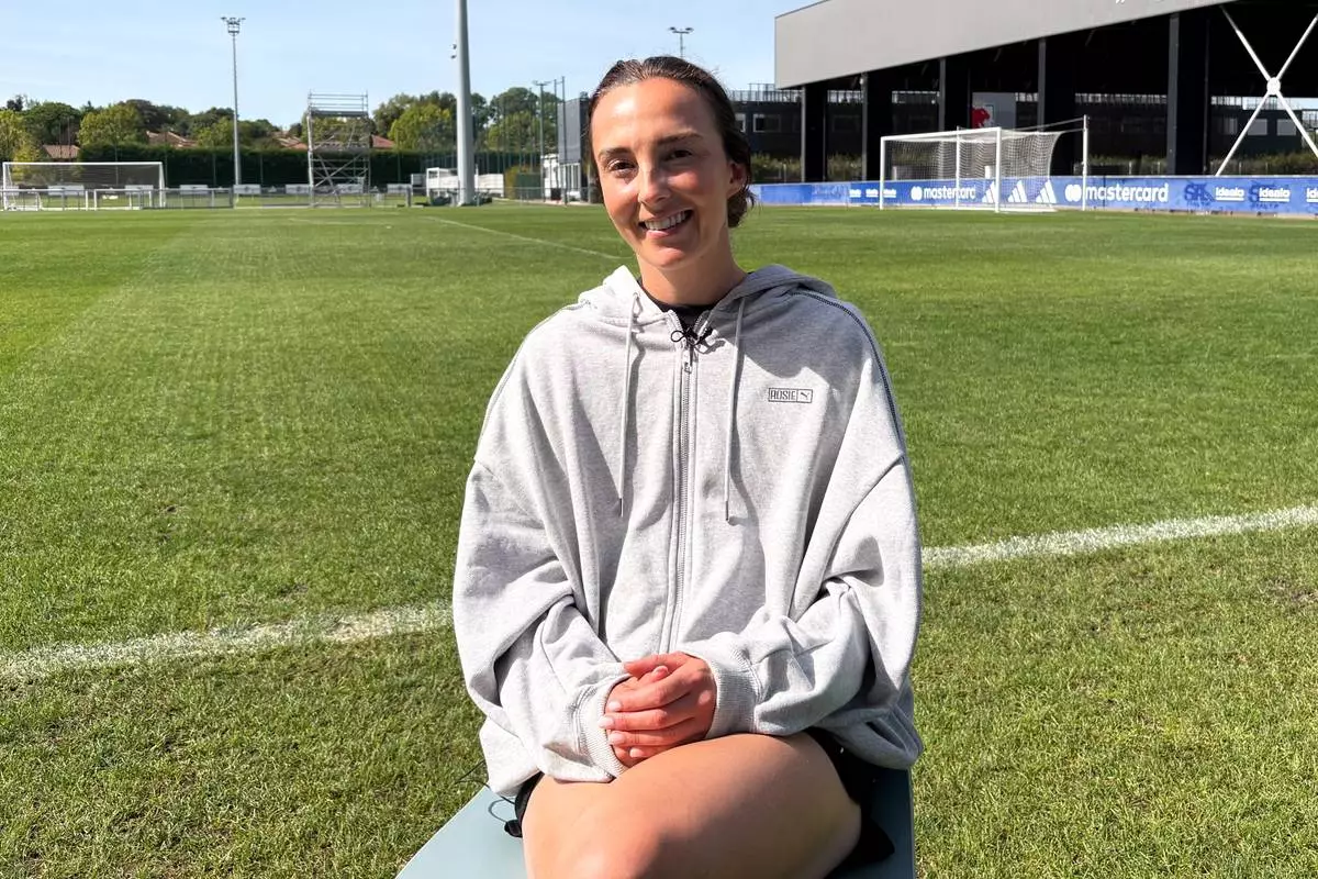 OL Lyonnes midfielder Caroline Weir sits down for an interview at the club's training ground ahead of the start of the Women's Champions League, Monday, Sept. 21, 2026, in Lyon, France. (AP Photo/Jerome Pugmire)