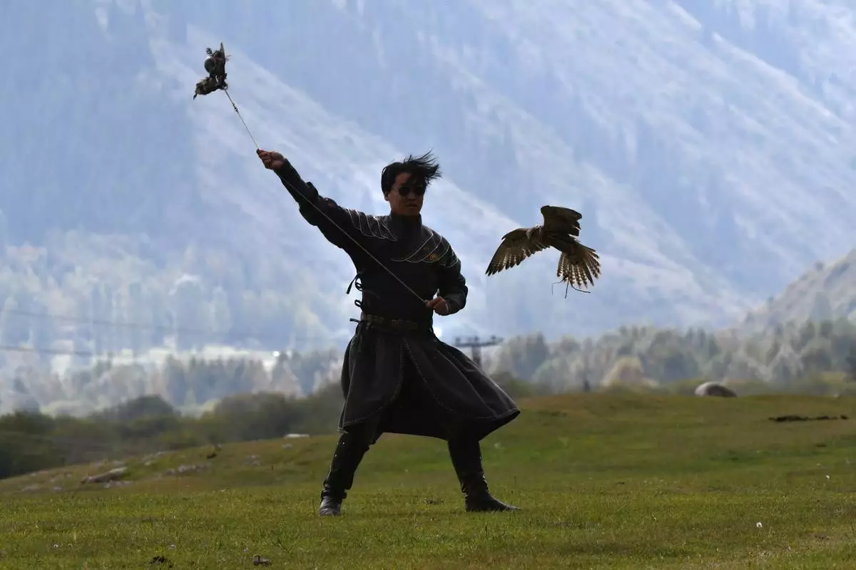 A Mongolian hunter with golden eagle competes during at the World Nomad Games in Kyrchyn Gorge, 240 kms. (150 miles) southeast of Bishkek, Kyrgyzstan, on Thursday, Sept. 3, 2026. (AP Photo/Vladimir Voronin)
