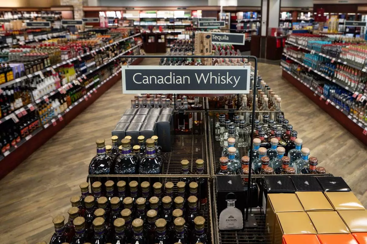 FILE - Canadian whisky is pictured at a British Columbia Liquor store in Vancouver on Aug. 25, 2026. (Ethan Cairns/The Canadian Press via AP, File)