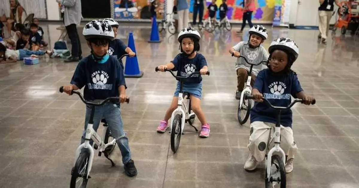 A childhood rite moves indoors as kindergartners learn to ride bikes in school gyms