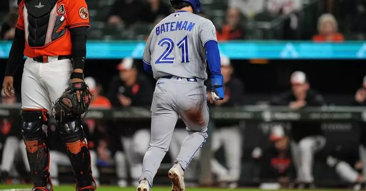 Blue Jays center fielder Brett Bateman injured while making sliding catch against Orioles