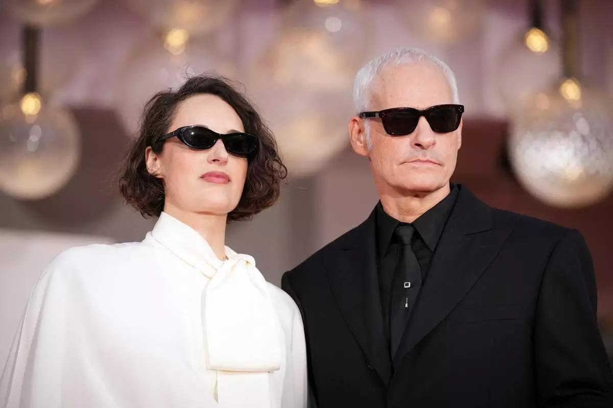Phoebe Waller-Bridge, left, and director Martin McDonagh pose for photographers at the red carpet for the film 'Wild Horse Nine' during the 83rd edition of the Venice Film Festival in Venice, Italy, on Thursday, Sept. 3, 2026. (Photo by Alessandra Tarantino/Invision/AP)
