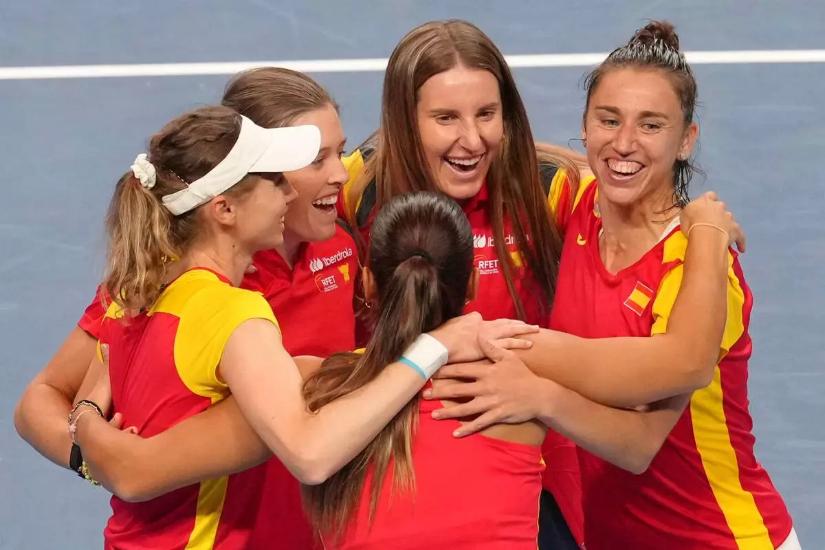 Spain's team members celebrate after defeating Kazakhstan in a quarterfinal match for the Billie Jean King Cup held in Shenzhen in southern China's Guangdong province, Wednesday, Sept. 23, 2026. (AP Photo/Andy Wong)