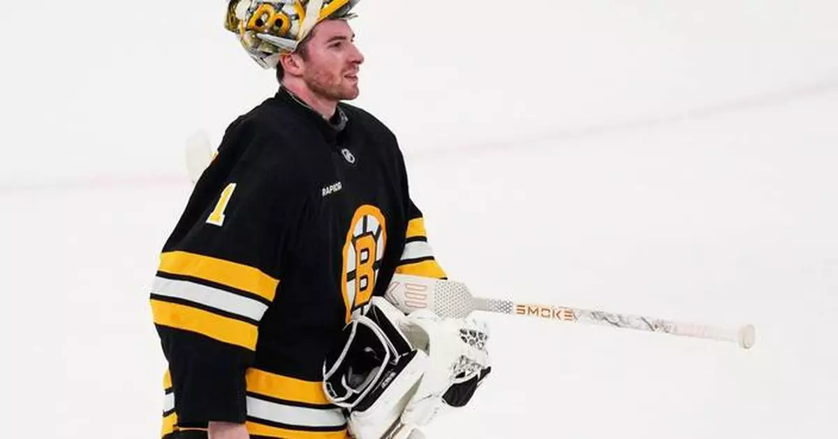 Bruins goalie Jeremy Swayman and some teammates put away sticks to take BP at Fenway Park