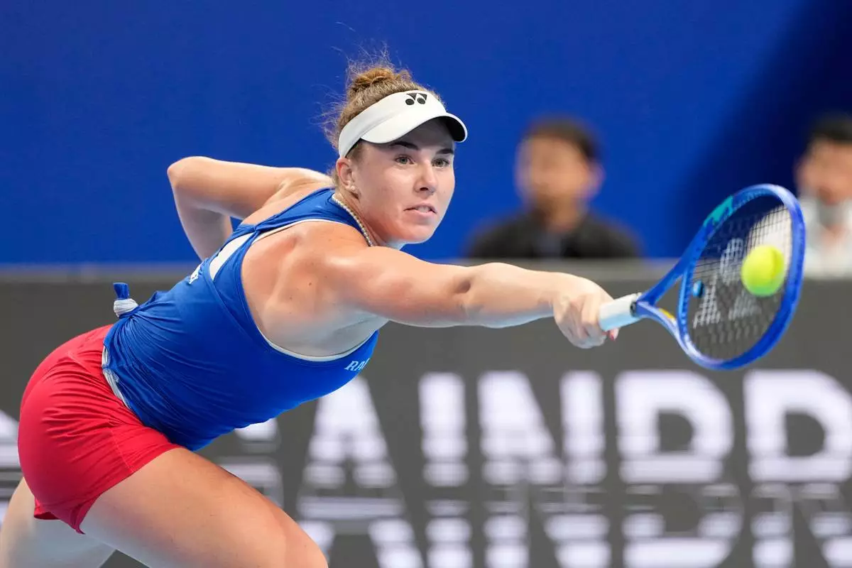 Czech Republic's Linda Noskova returns the ball to Spain's Cristina Bucsa during the Billie Jean King Cup women's singles semifinal tennis match between Spain and Czech Republic, in Shenzhen, China, Friday, Sept. 25, 2026. (AP Photo/Andy Wong)