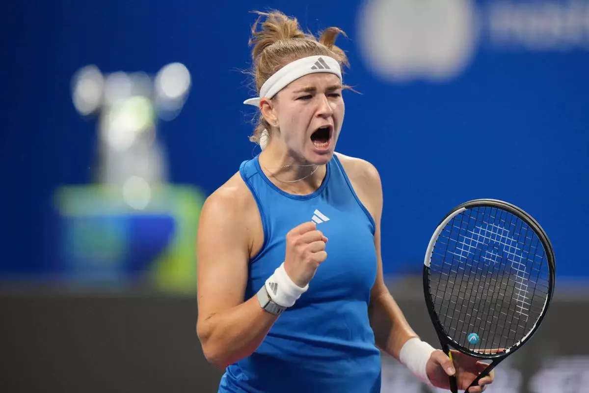 Czech Republic's Karolina Muchova celebrates a point against Spain's Jessica Bouzas Maneiro during the Billie Jean King Cup women's singles semifinal tennis match between Spain and Czech Republic, in Shenzhen, China, Friday, Sept. 25, 2026. (AP Photo/Andy Wong)