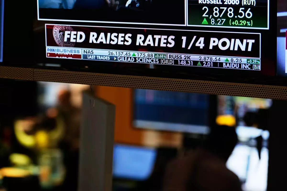 Screens display financial information on the floor at the New York Stock Exchange in New York, Wednesday, Sept. 16, 2026. (AP Photo/Seth Wenig)