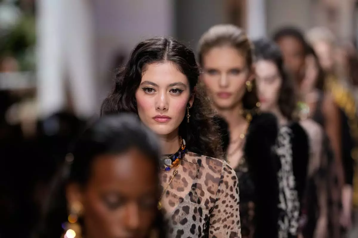 A model wears a creation part of Dolce & Gabbana women's Spring-Summer 2027 collection, presented in Milan, Italy, Saturday, Sept. 26, 2026. (AP Photo/Luca Bruno)