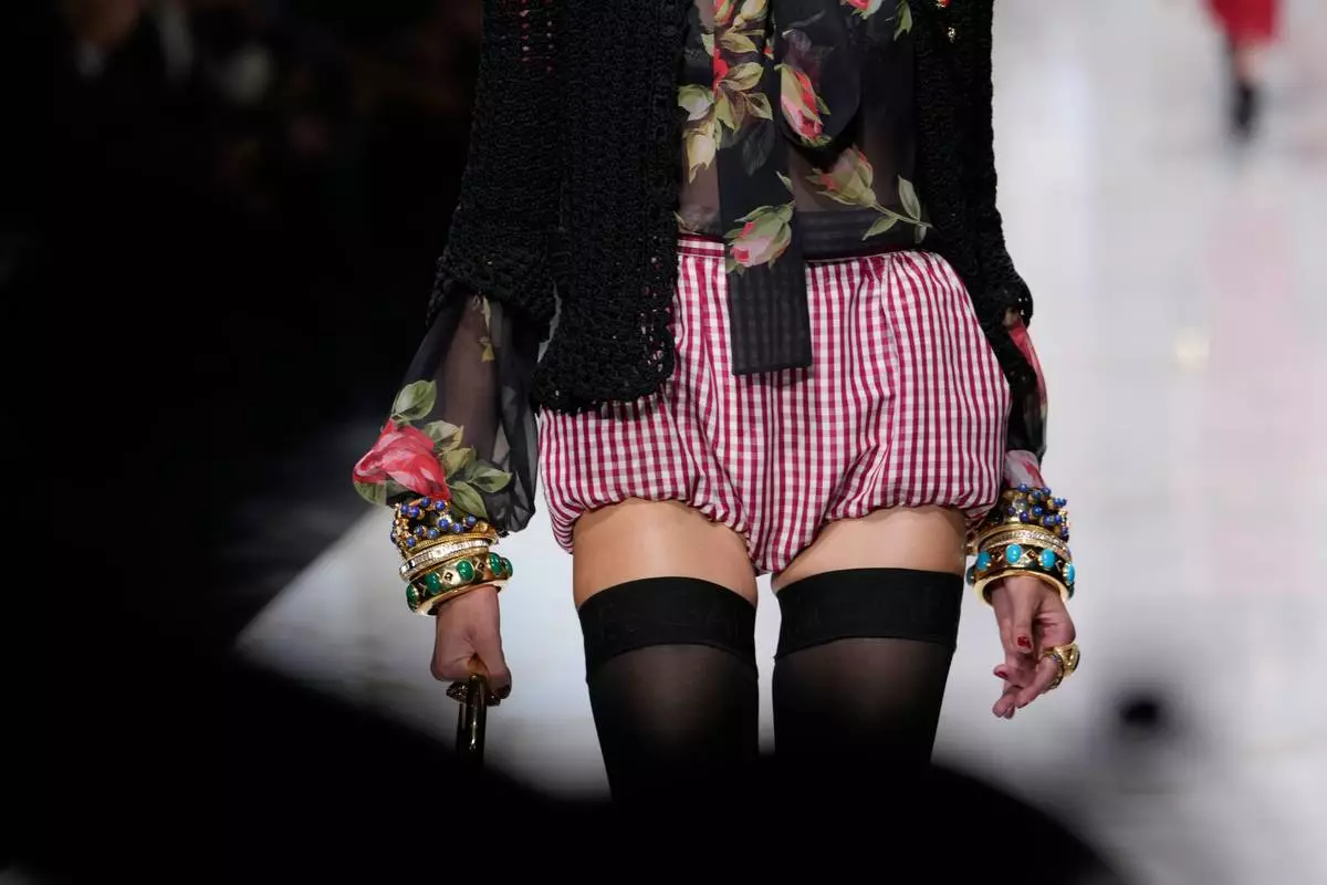 A model wears a creation part of Dolce & Gabbana women's Spring-Summer 2027 collection, presented in Milan, Italy, Saturday, Sept. 26, 2026. (AP Photo/Luca Bruno)