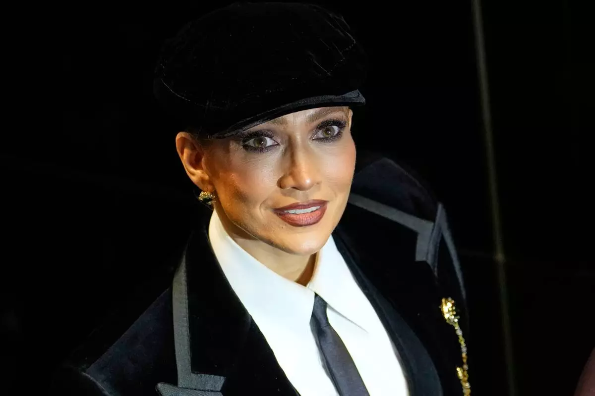 Jennifer Lopez arrives to attend the Dolce & Gabbana women's Spring-Summer 2027 fashion show, presented in Milan, Italy, Saturday, Sept. 26, 2026. (AP Photo/Luca Bruno).