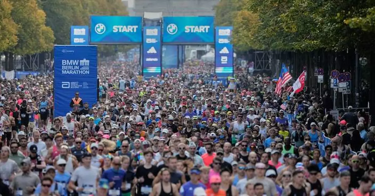 Cramps derail Tigst Assefa's world record as Guye Adola wins Berlin Marathon