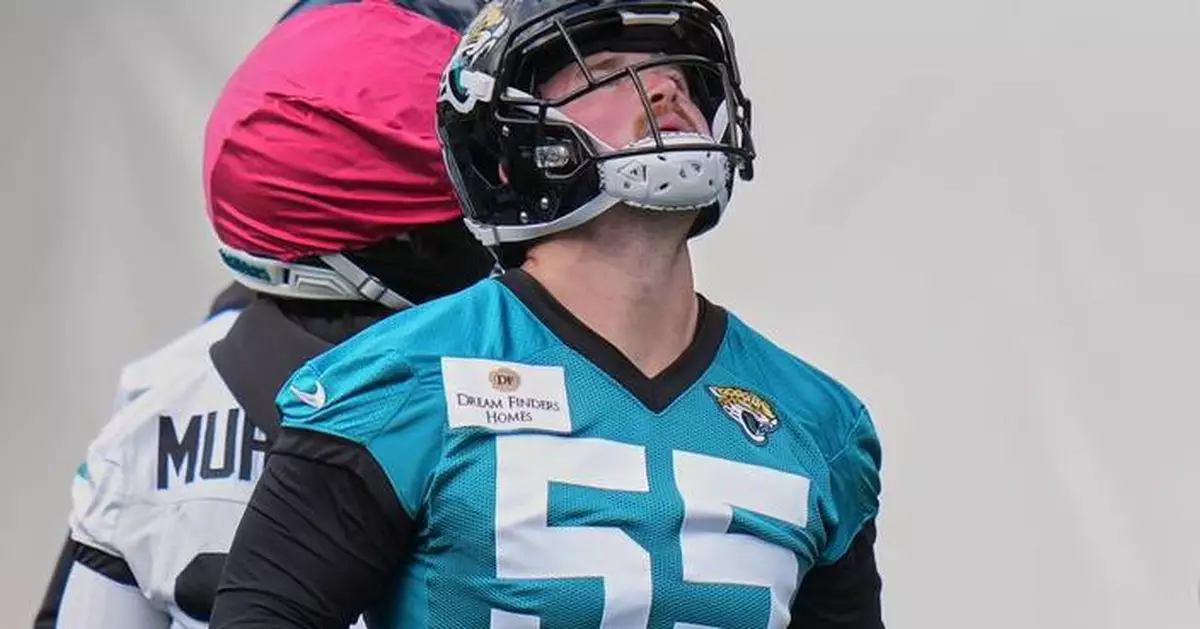 Long snapper cuts short camping trip and locates passport to sign with Jaguars in London