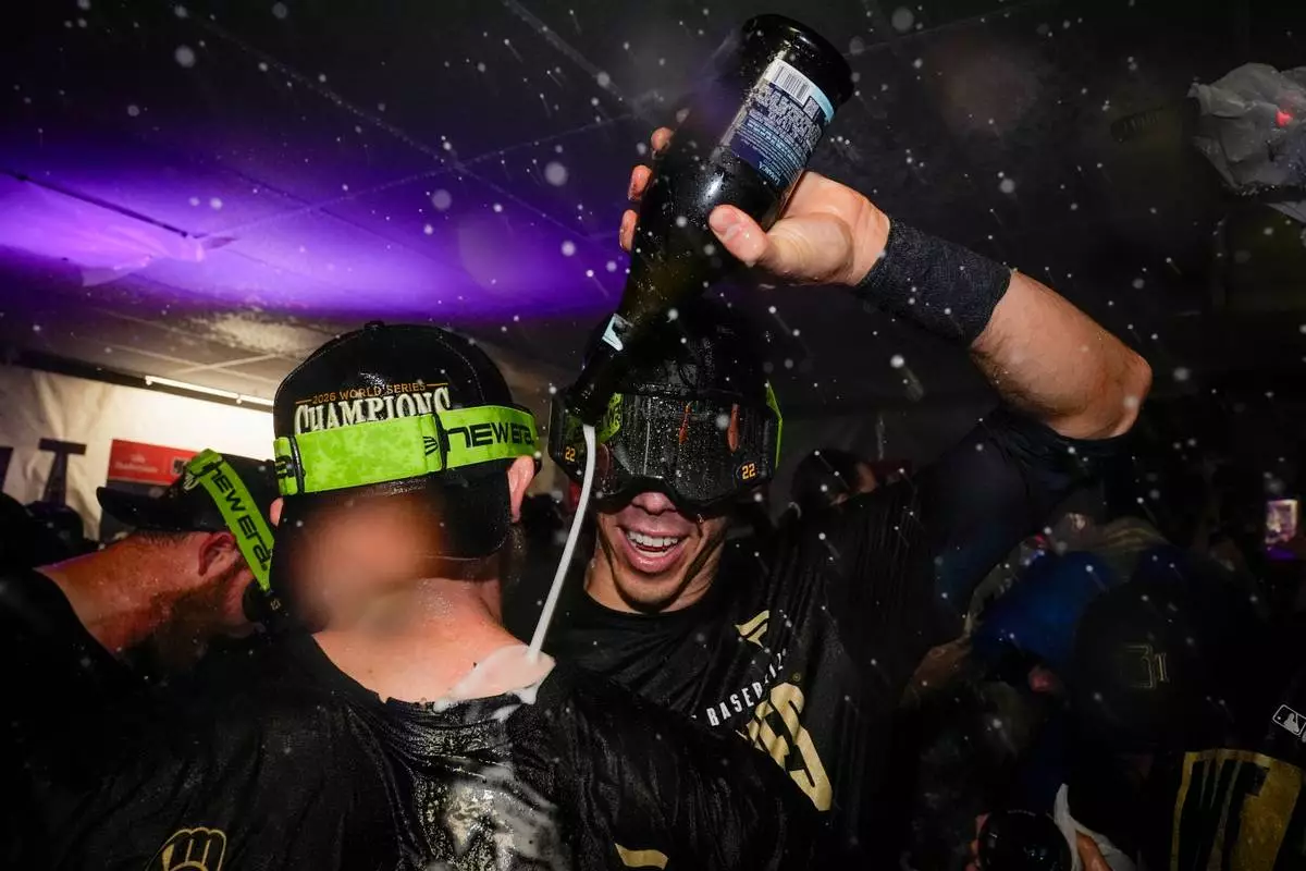 Milwaukee Brewers designated hitter Christian Yelich celebrates with teammates after winning baseball's World Series, against the Tampa Bay Rays, Wednesday, Oct. 28, 2026, in St. Petersburg, Fla. (AP Photo/Chris O'Meara)