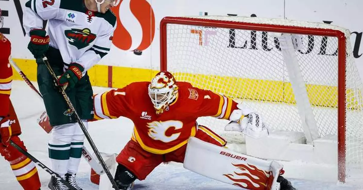 Cooley makes 36 saves in the Flames' 2-1 victory over the Wild