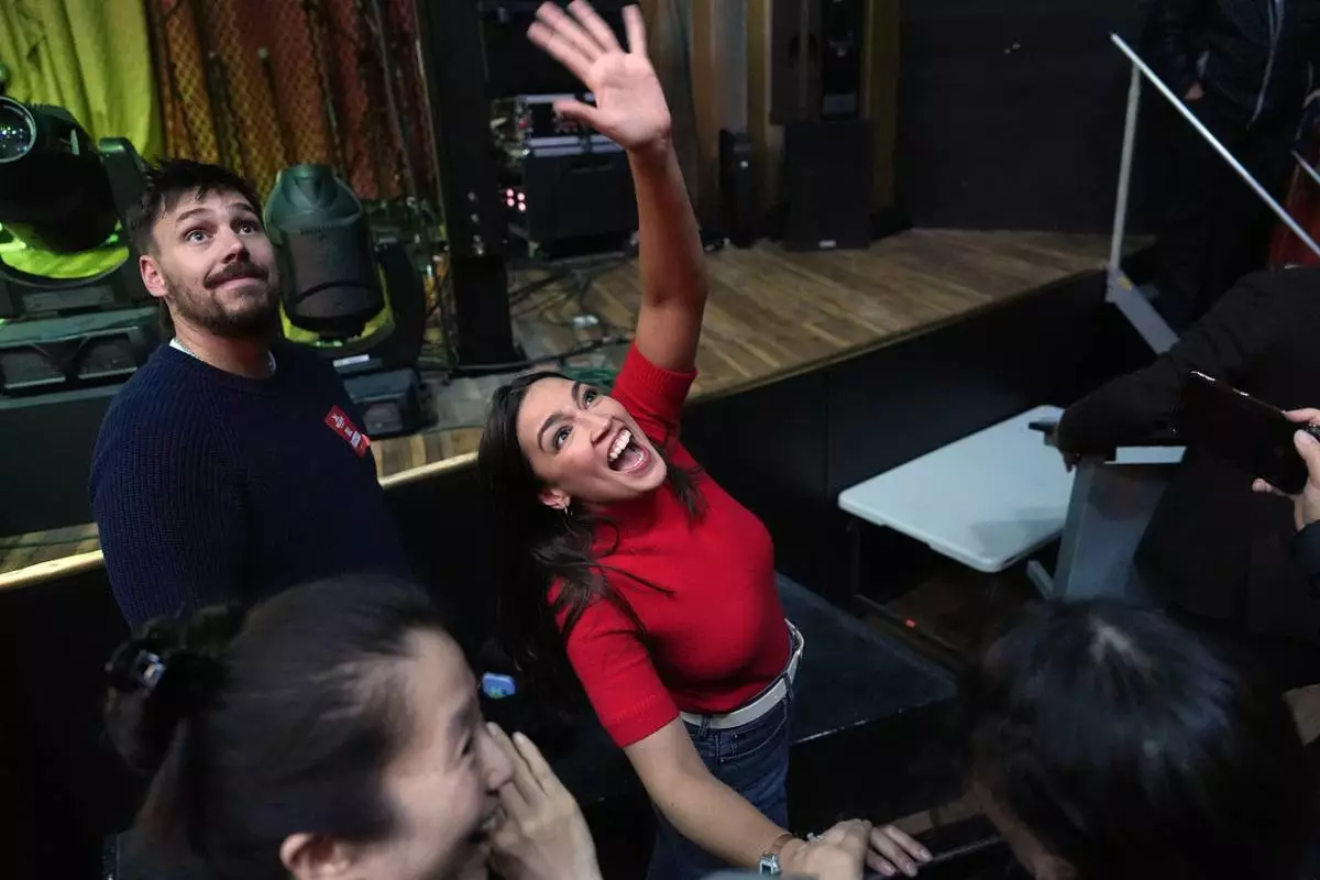 Rep. Alexandria Ocasio-Cortez, D-N.Y., waves after a campaign rally for Randy Villegas, Democratic candidate for congress in California's 22nd District, Friday, Oct. 23, 2026, in Bakersfield, Calif. (AP Photo/Jae C. Hong)