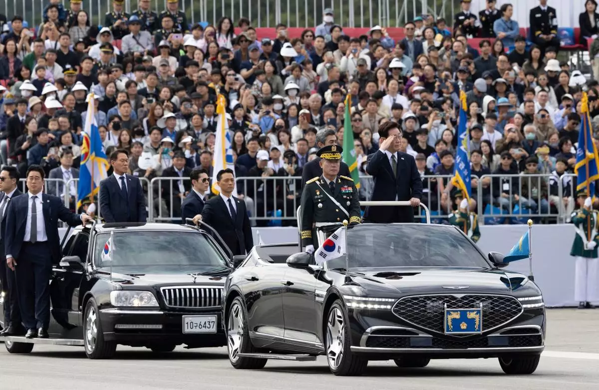 South Korean President Lee Jae Myung, right, inspect military personnel during the Armed Forces Day at a military base in Gyeyong, South Korea, Thursday, Oct. 1, 2026. (Jeon Heon-kyun/Pool Photo via AP)