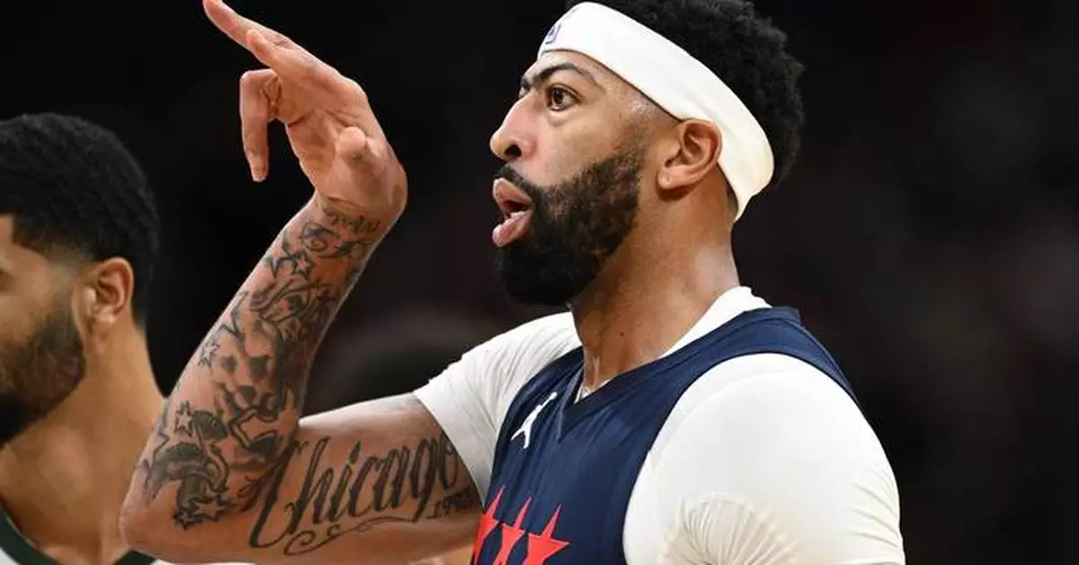Davis scores 34 points in his Washington debut, leading the Wizards over Milwaukee 128-116